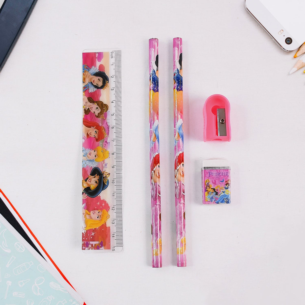 Close-up of the Cartoon Wooden Pencil Set showing a pencil, ruler, sharpener, and eraser.