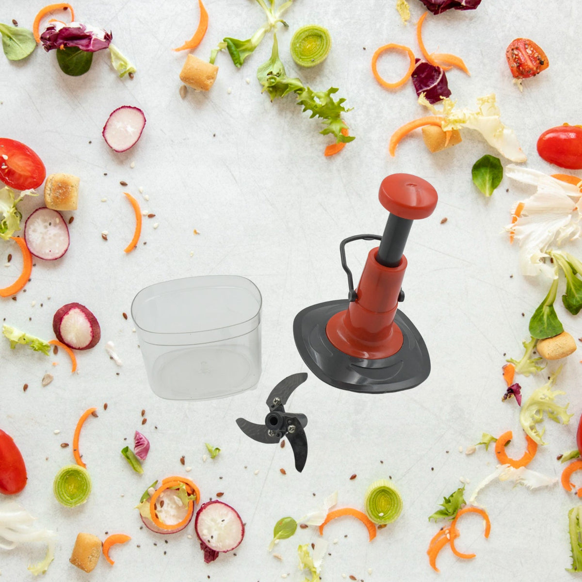 The 650ml manual food chopper disassembled, showing the stainless steel blades and container.