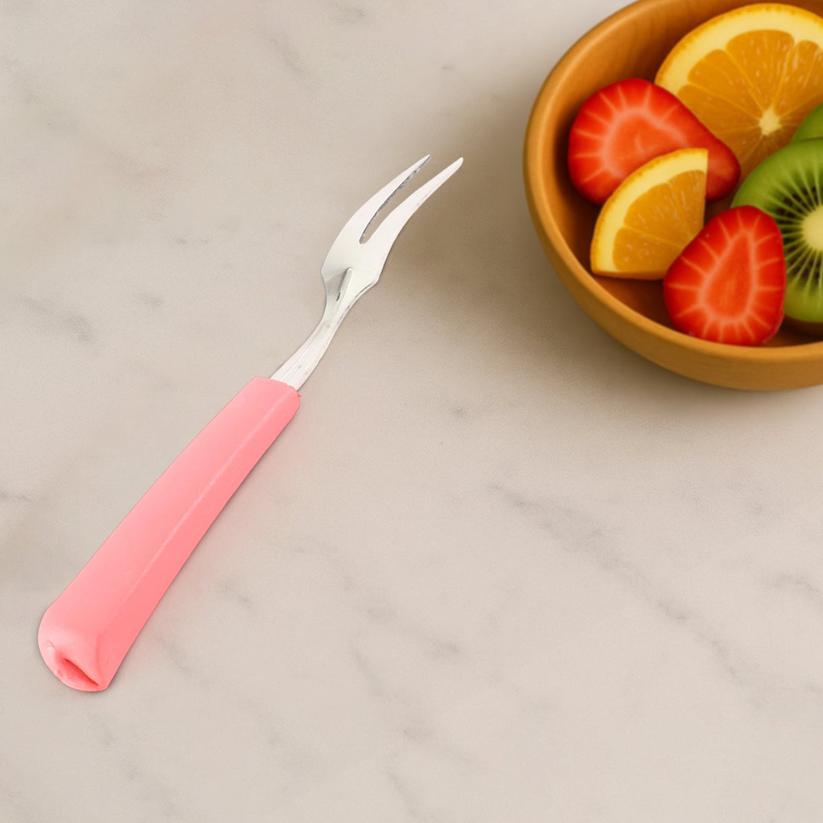 Pink handle detail on stainless steel mini fruit fork