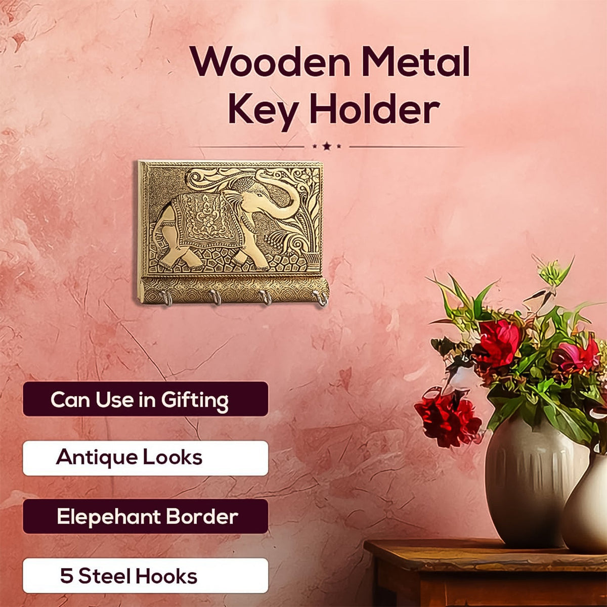 Front view of the wooden elephant key holder featuring four gold metal hooks.