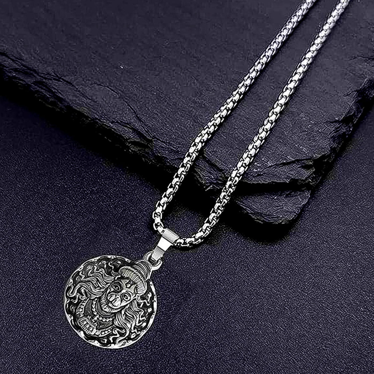Detailed view of the Hanuman Locket with its accompanying chain.
