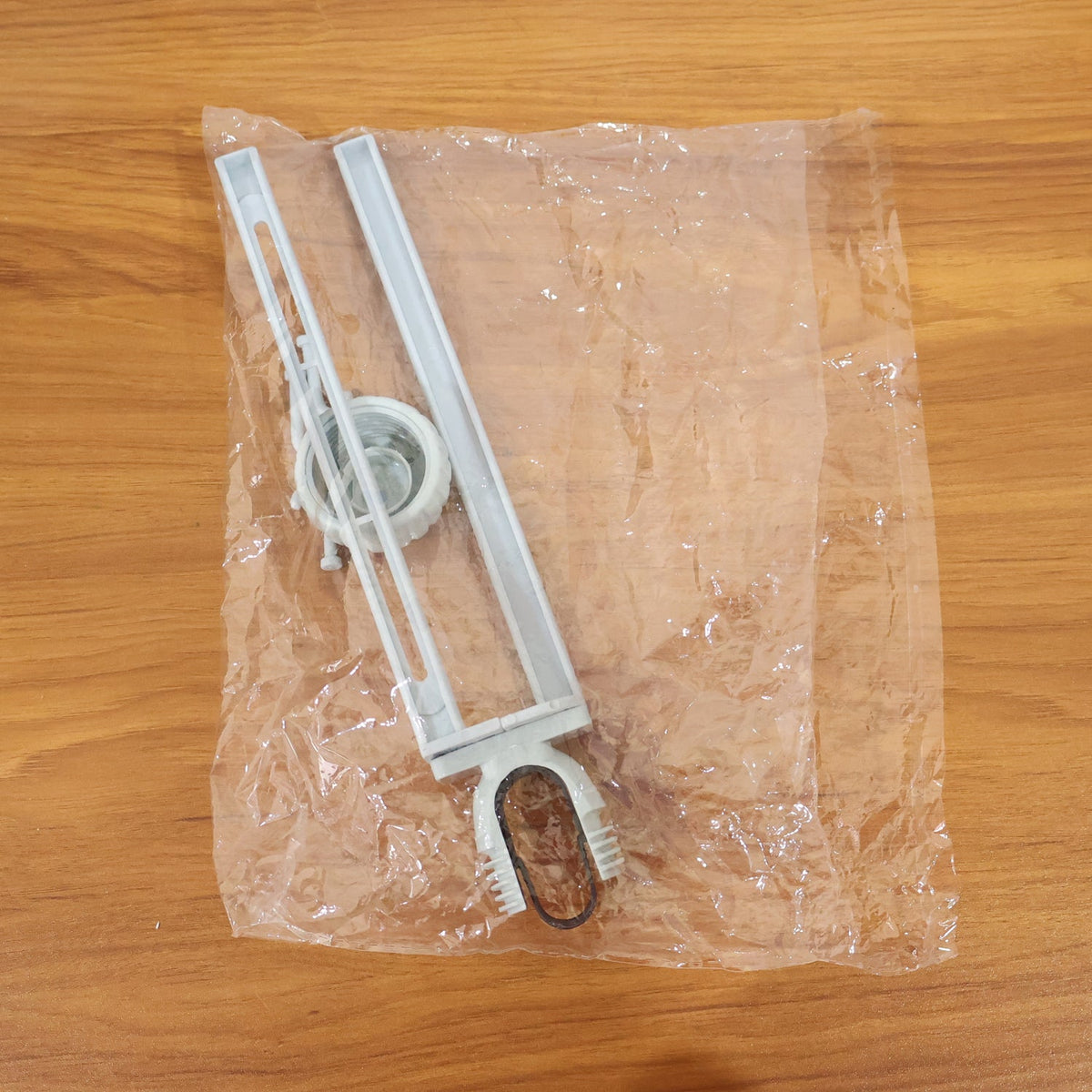 Multipurpose organizer hanging from kitchen sink faucet