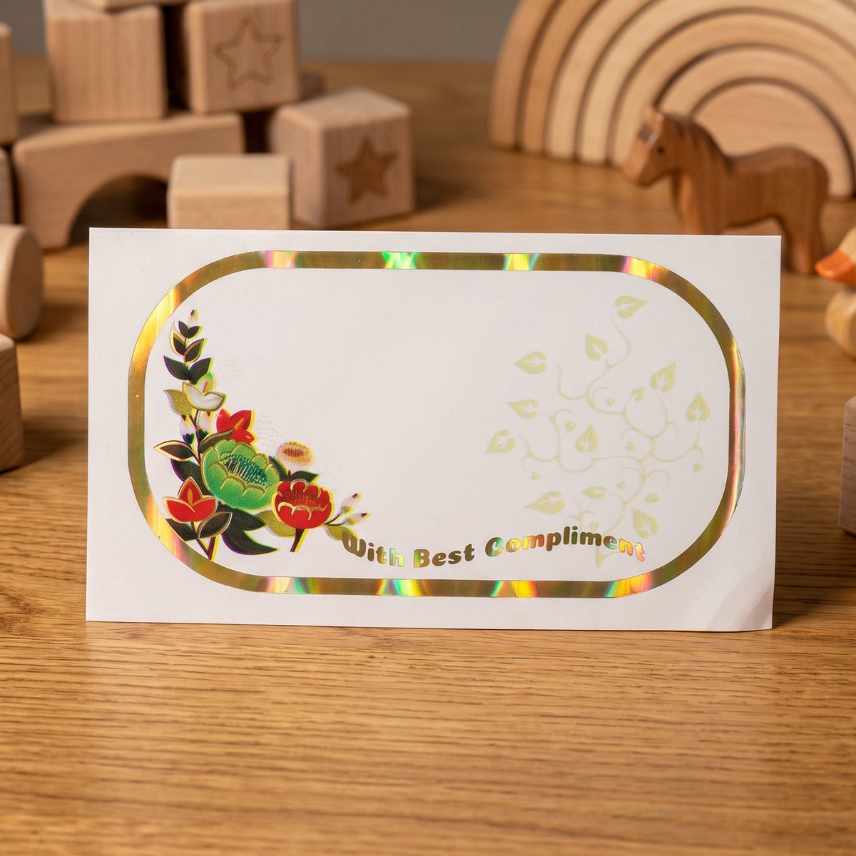 Close-up of floral foil gift stickers with writable space