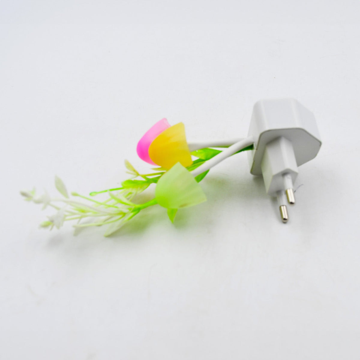 Whimsical mushroom night light glowing with vibrant, changing LED colors.