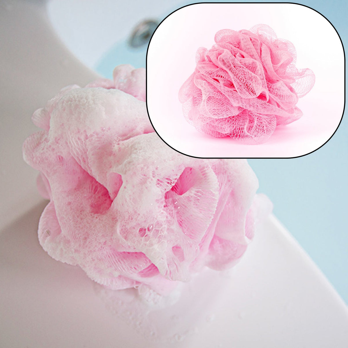 Hand holding a white bath loofah, ready for shower use.